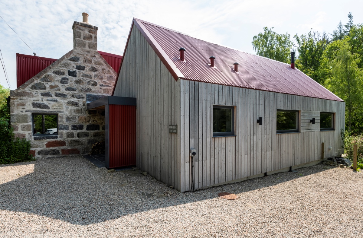 Back of Burnside Cottage showing clad building and gravel space