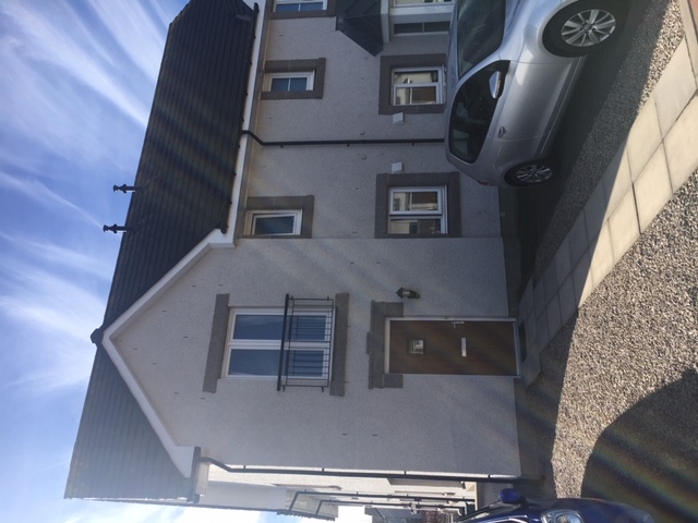 Front of the Berryhill Cercle property. Semi-detached house with driveway and chuckies at the front