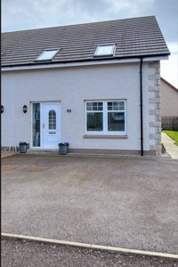 Front of 58 Ladysbridge Drive, detached house with paved driveway